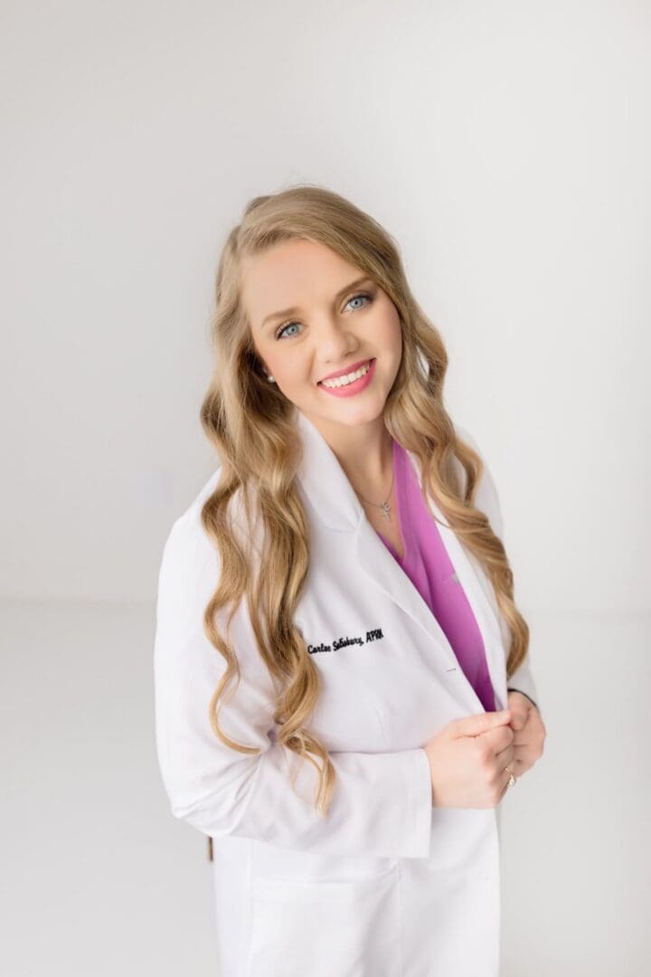 Smiling female medical professional in white coat
